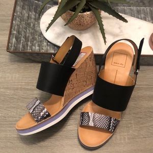 Black wedge sandals with snakeskin accent